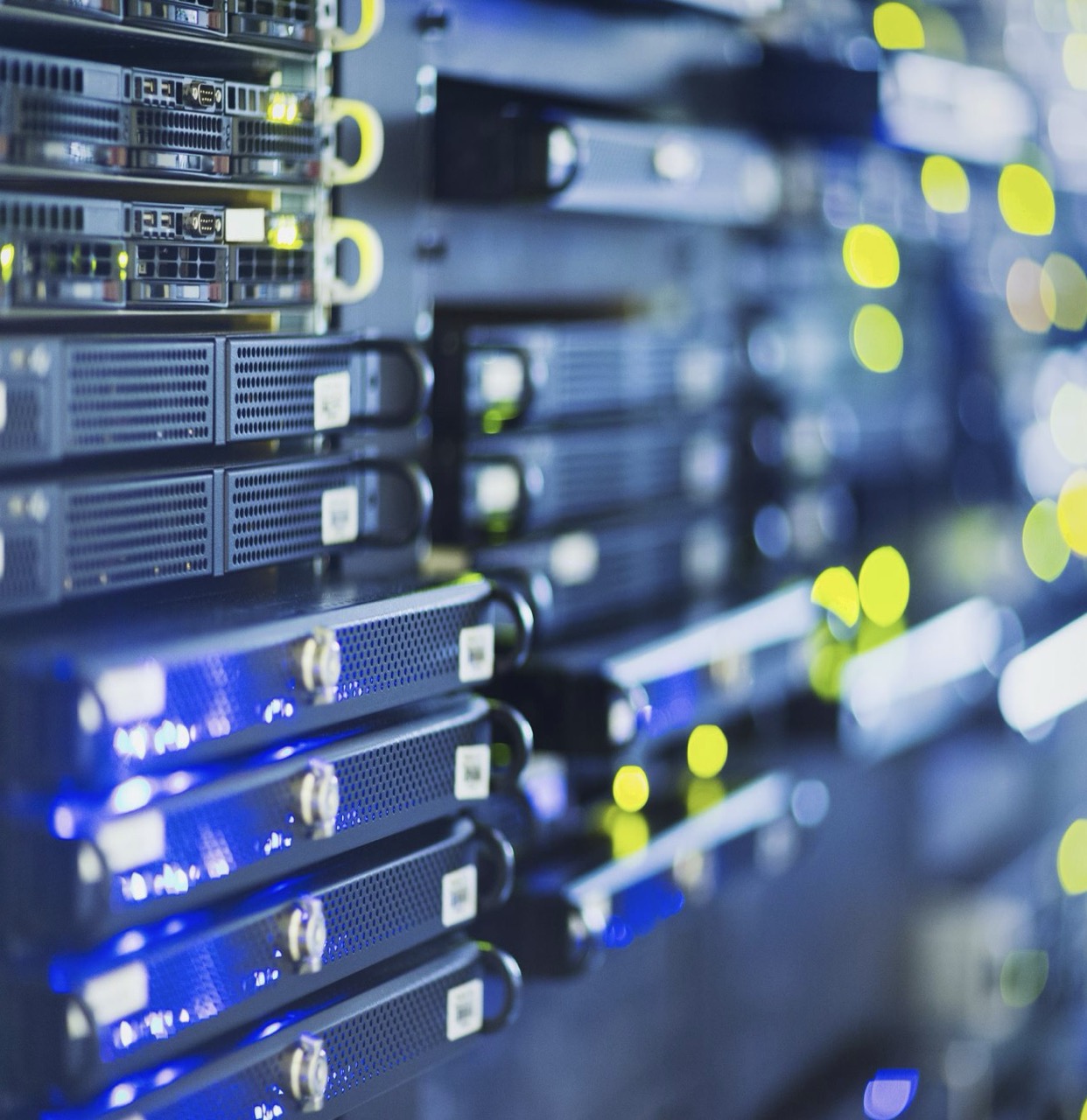 Server racks in a mission-critical data center with blue LED lighting